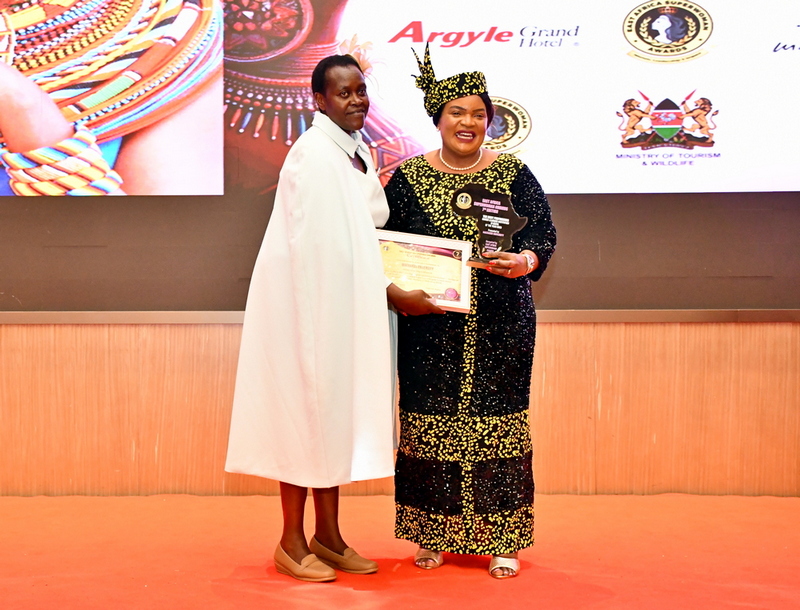 A defining moment as the Vice-Chancellor  receives the award from the Principal Secretary during the ceremony